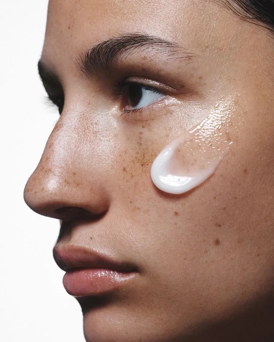 Close-up of a face with cream on cheek